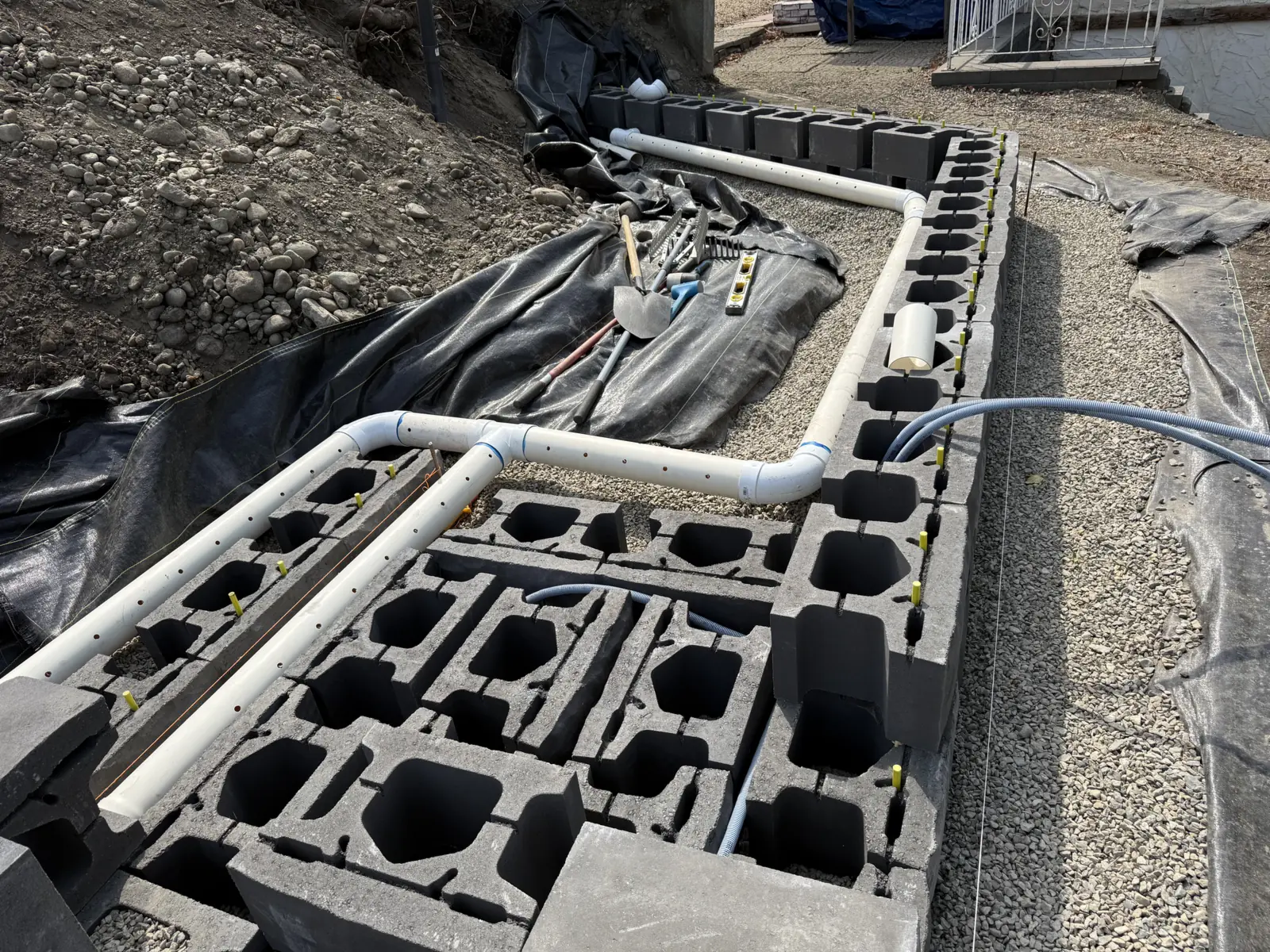 PVC pipe and conduit laid through the wall block cores
