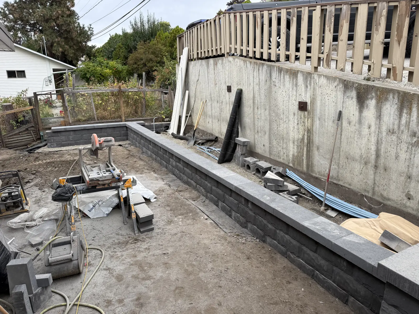 Block wall going in along a concrete foundation wall