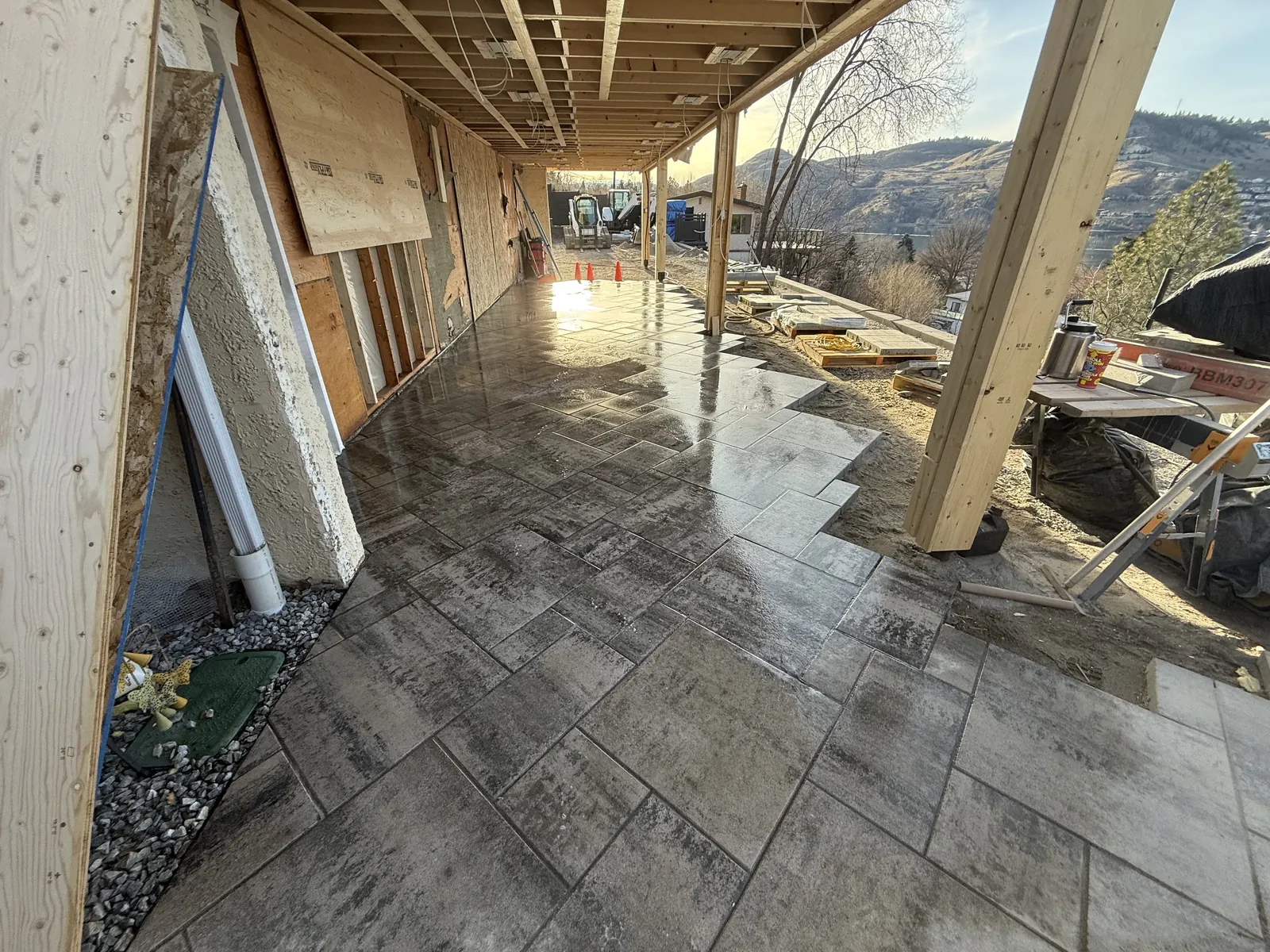 Large format pavers laid under a covered deck