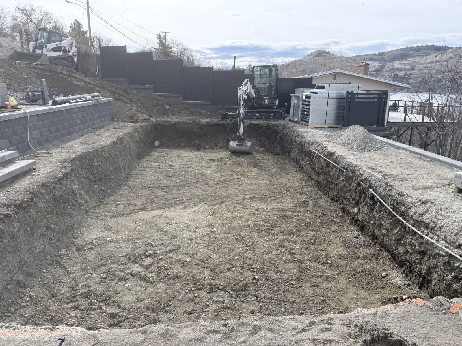 Pool excavation dug out below the terraced hillside