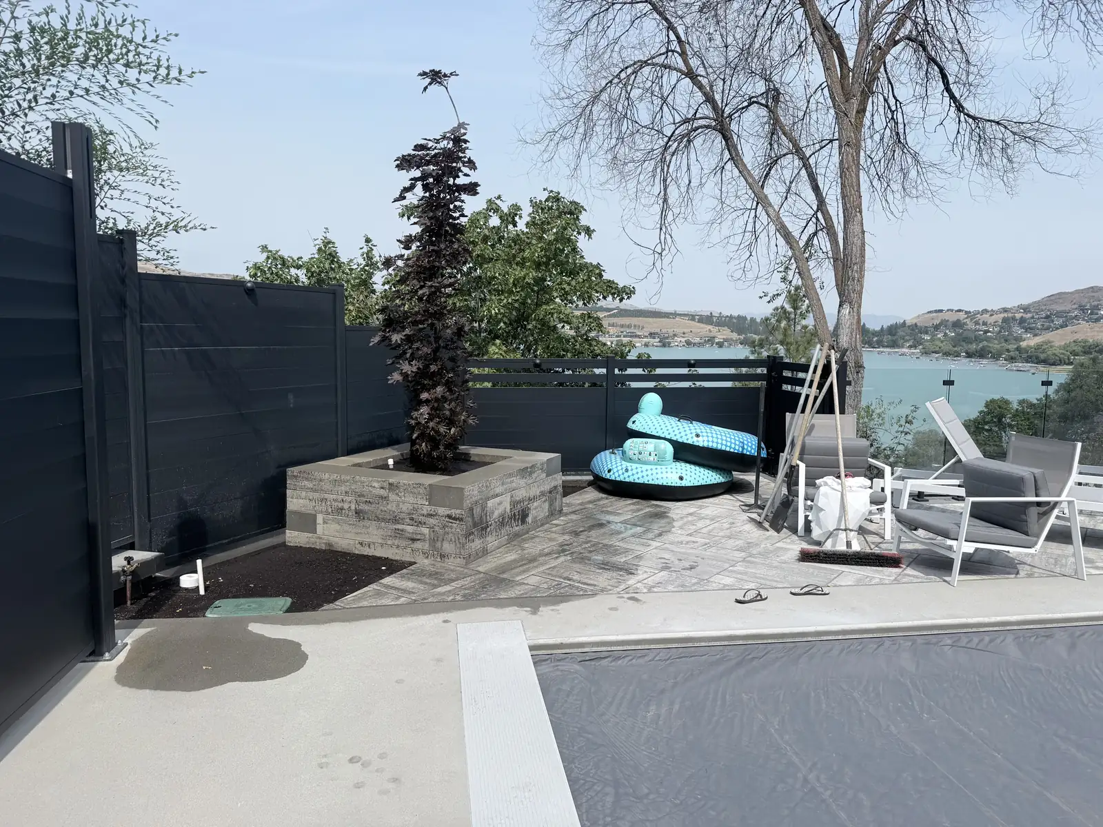 Finished pool deck and hardscape overlooking Okanagan Lake in Vernon BC